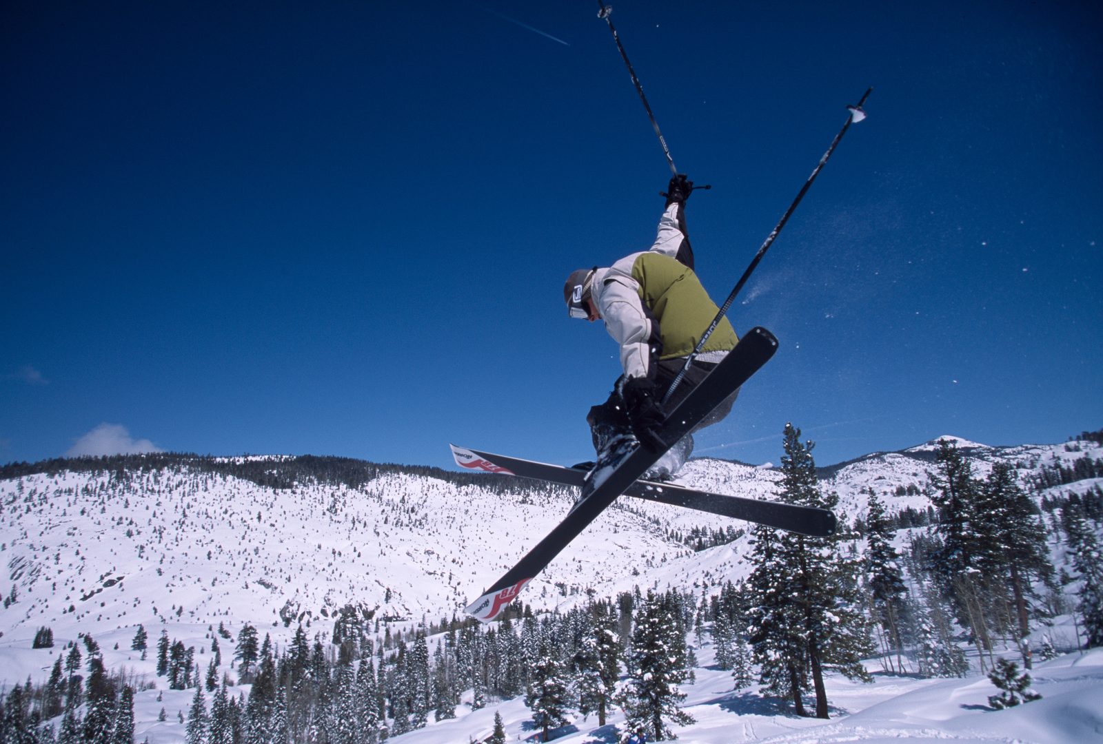 Snow-covered ski runs and lifts at a Sierra Nevada ski area