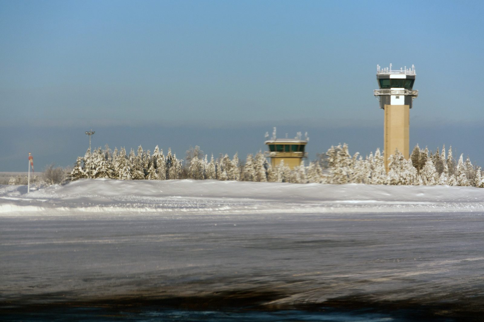 Rovaniemi Airport under snow with the control tower and frosted trees