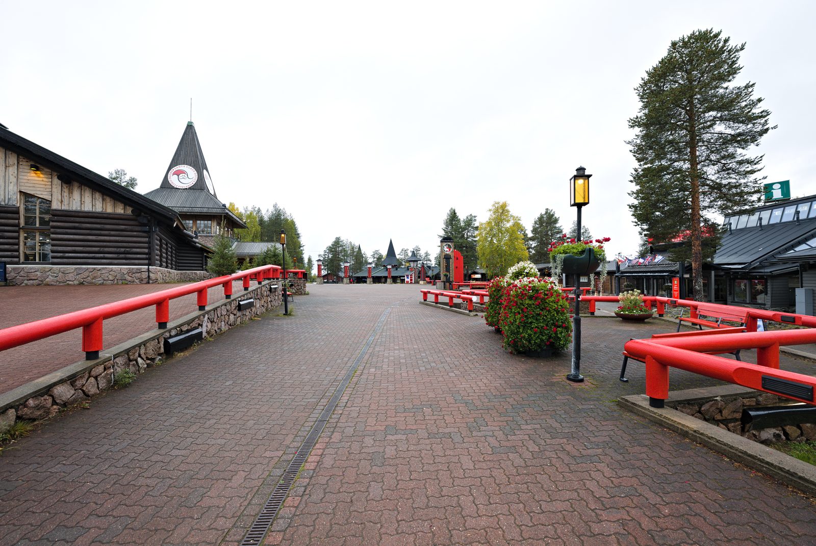 Wooden cabins and snow at Santa Claus Village near the Glass Resort