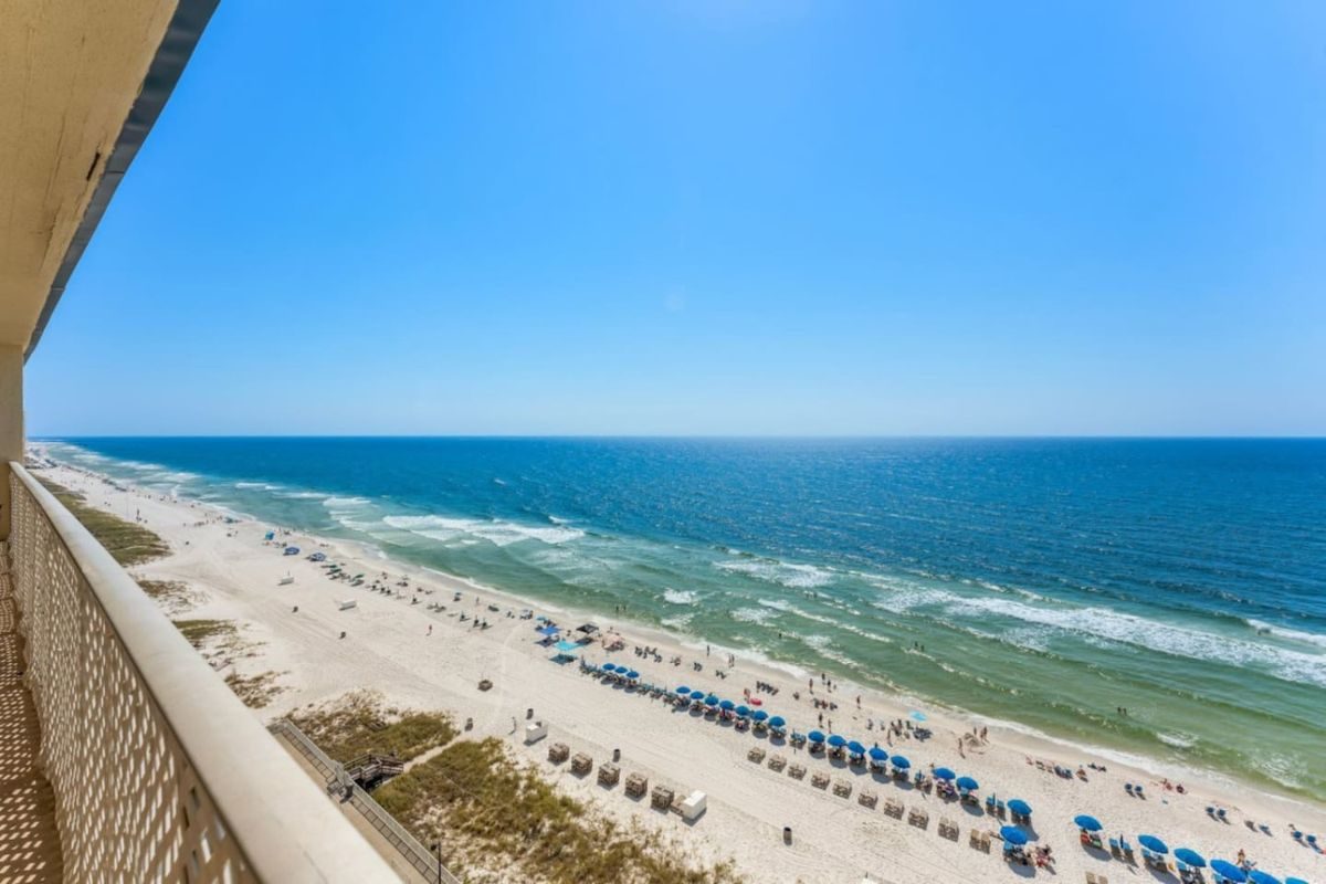 White sand and the emerald Gulf at Panama City Beach under a clear sky