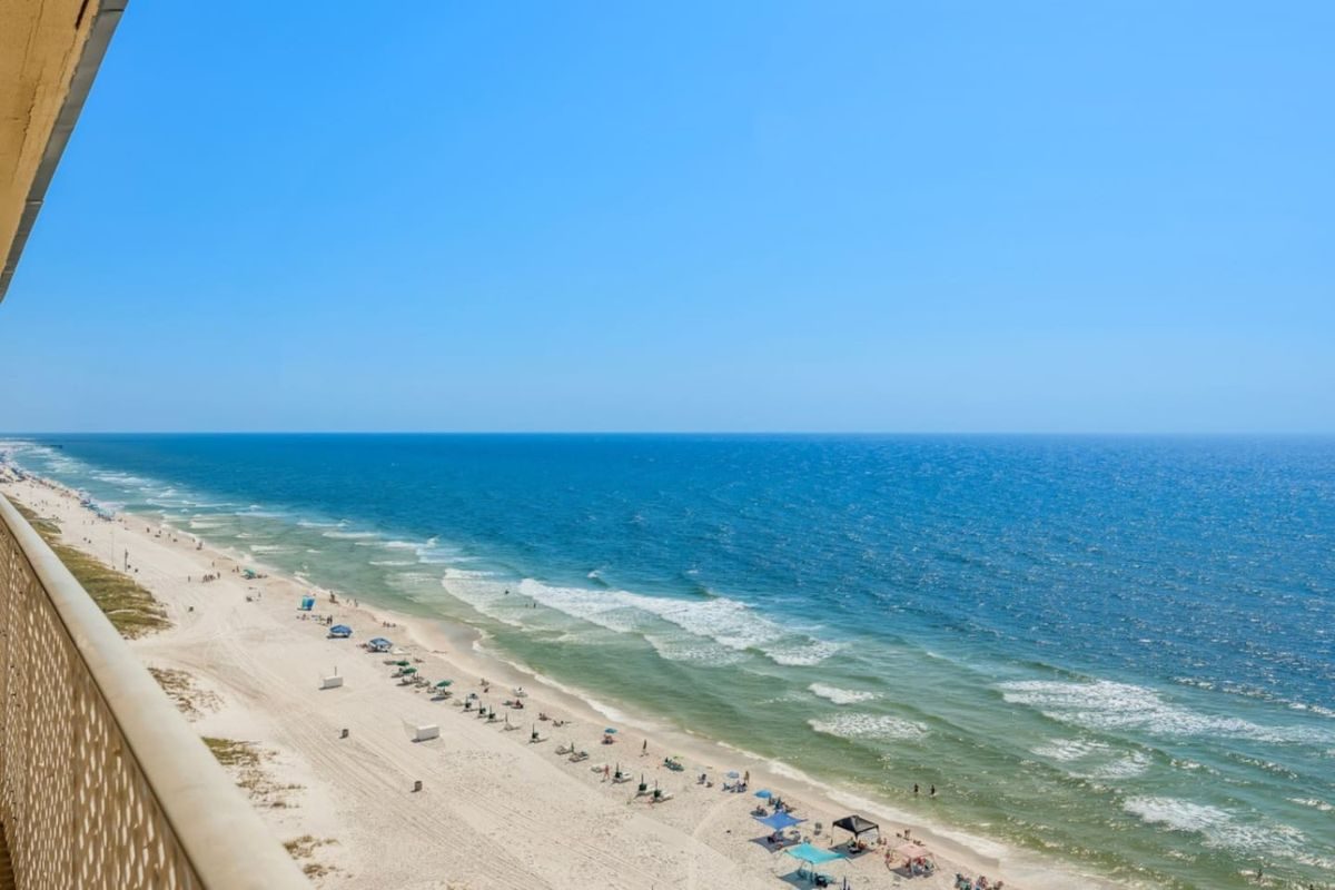 White sand, the emerald Gulf, and a bright blue sky atgulf-horizon.jpg